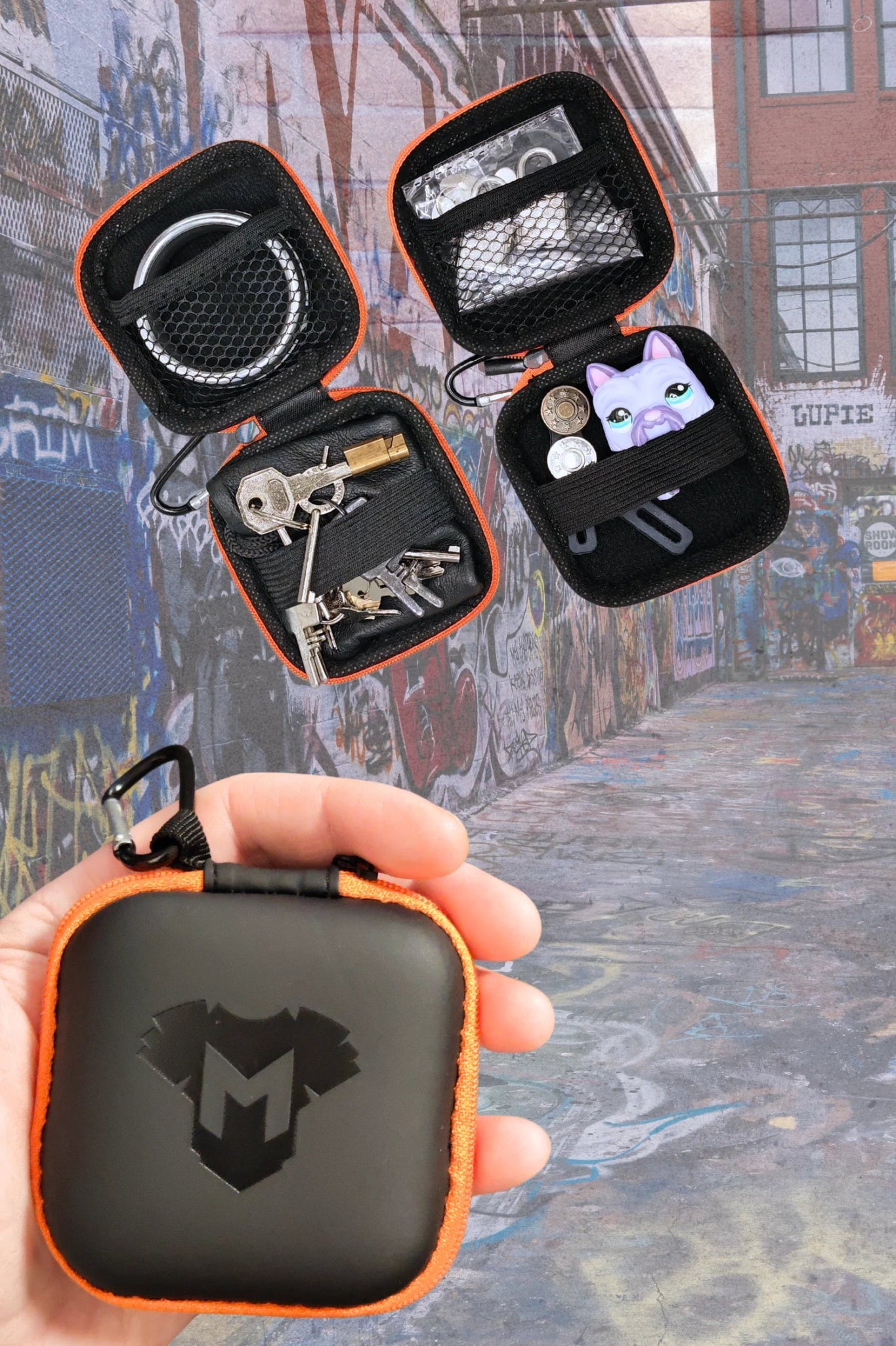 Maskulo Jax Wanderlust Mini Zip-Case with Carabiner, Black + Orange. Durable EVA/PU case for small items like cock rings or "Brown bottles."