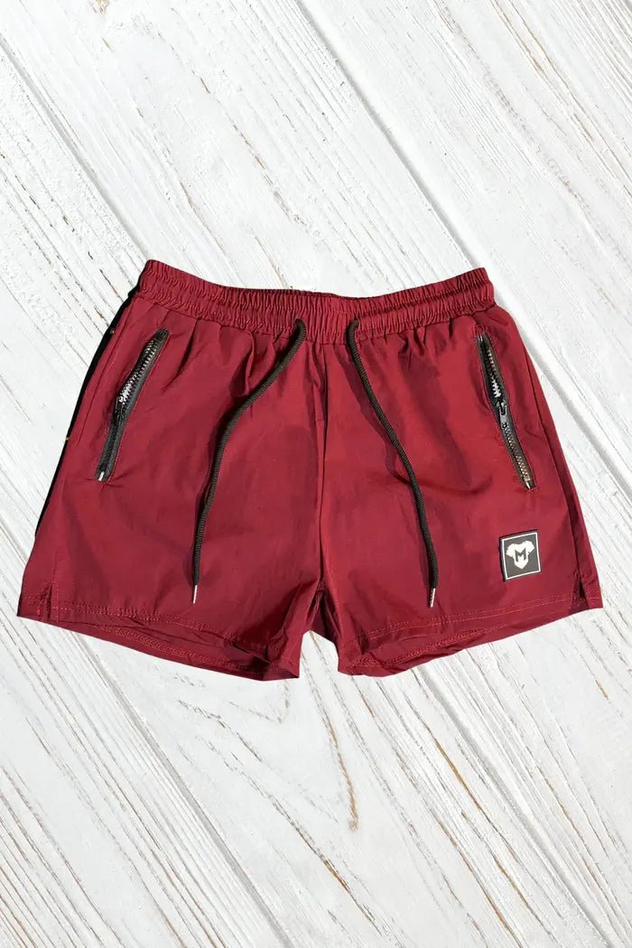 Maskulo Jedd Synther soft nylon-polyester shorts in Red Dark. Features stylish fit, smooth fabric, zip pockets, and mesh lining.
