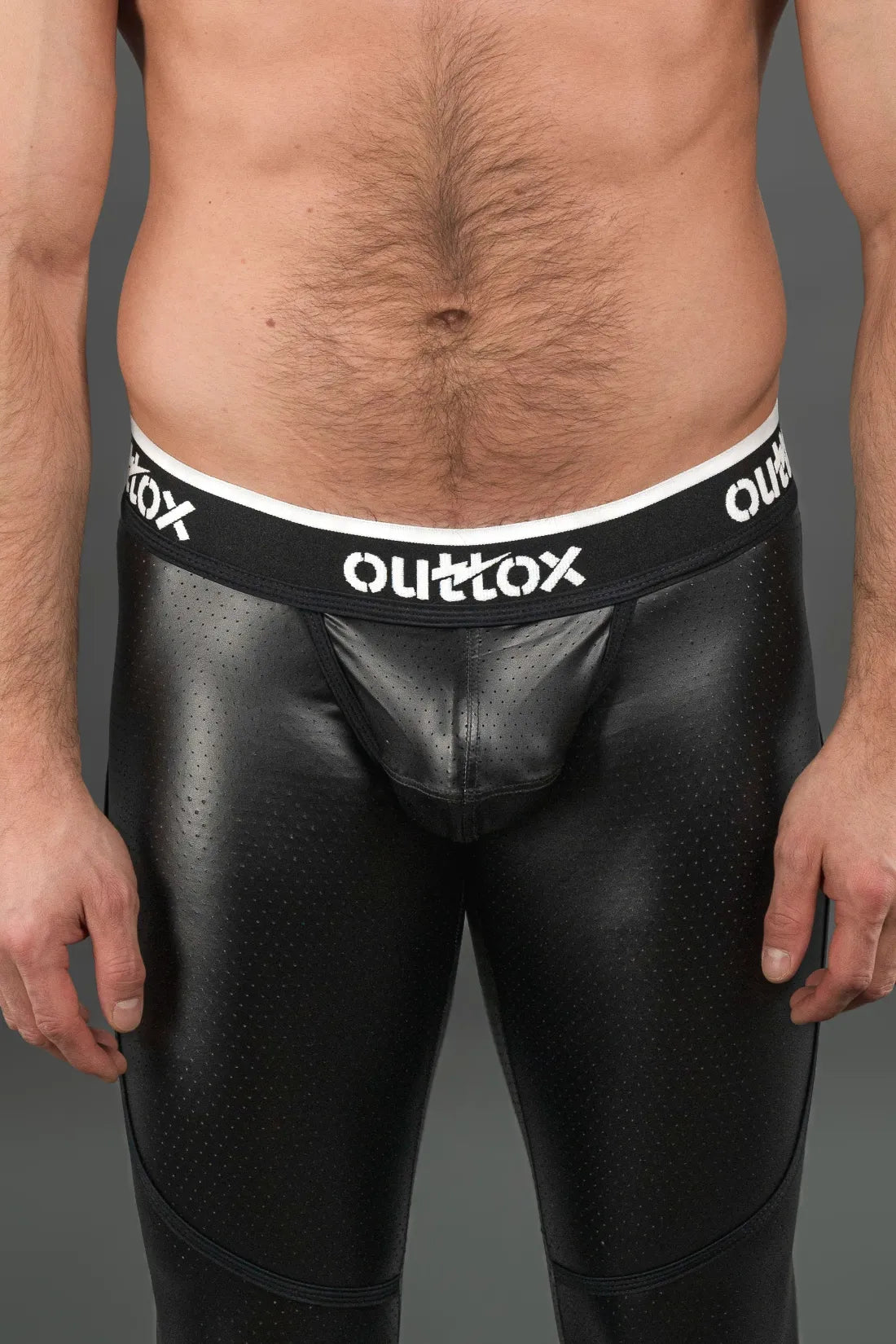 Outtox. Leggings mit Reißverschluss hinten und Druckknopf-Codpiece. Schwarz