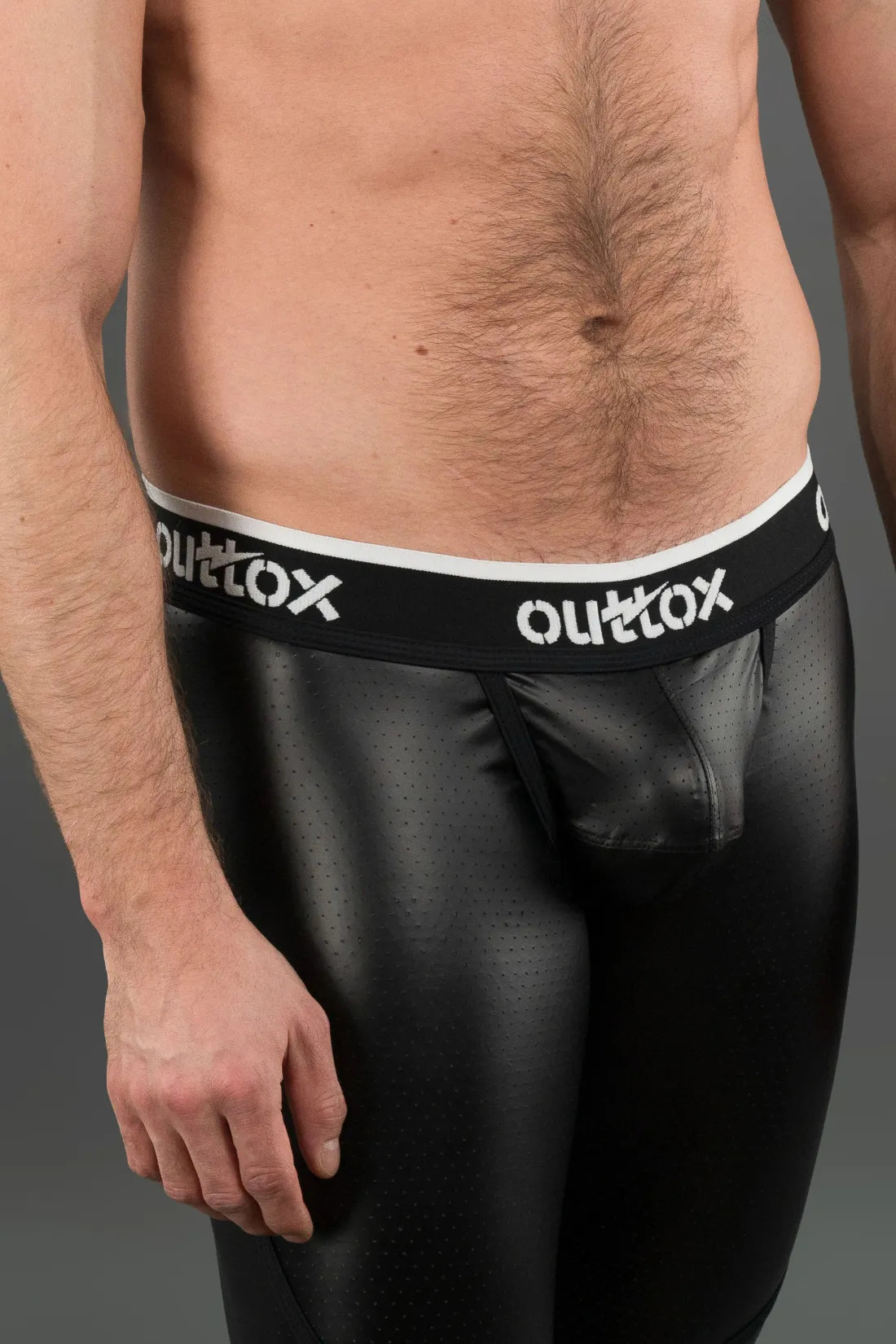 Outtox. Leggings mit Reißverschluss hinten und Druckknopf-Codpiece. Schwarz