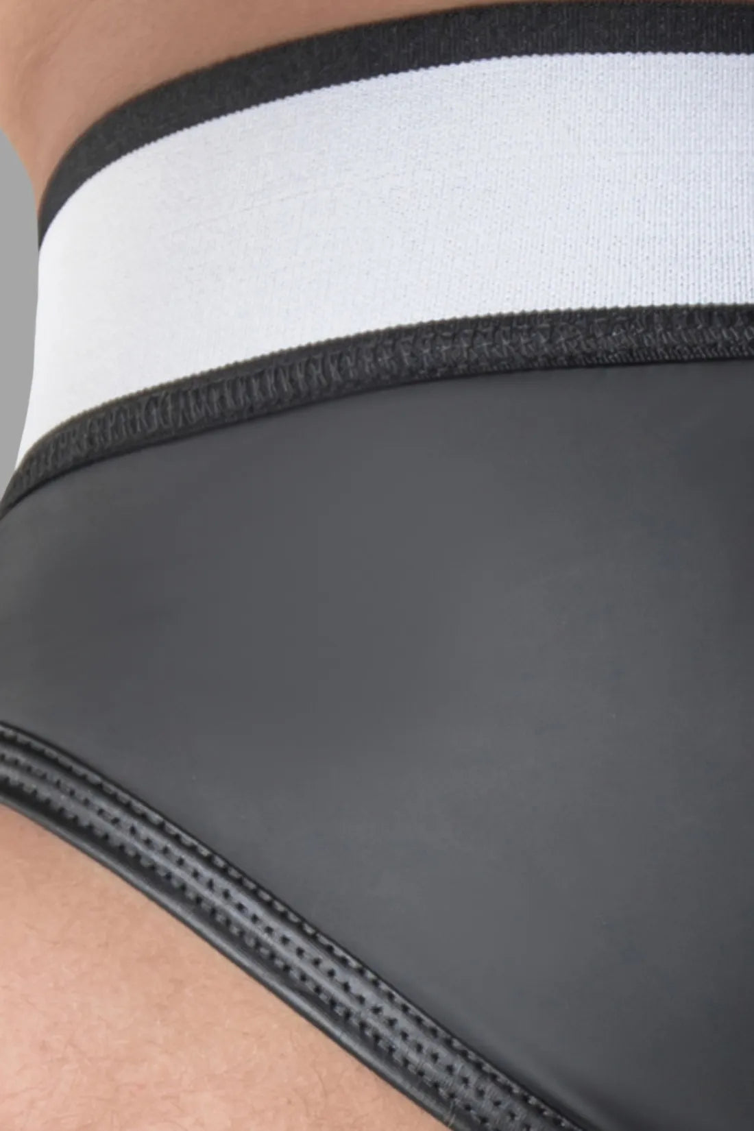 Armored. Rubber look Briefs. Detachable pouch. Open rear. Black